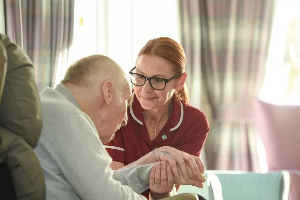 Carrer holding a mans hand